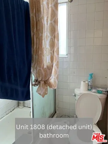 a bathroom with a toilet and a sink
