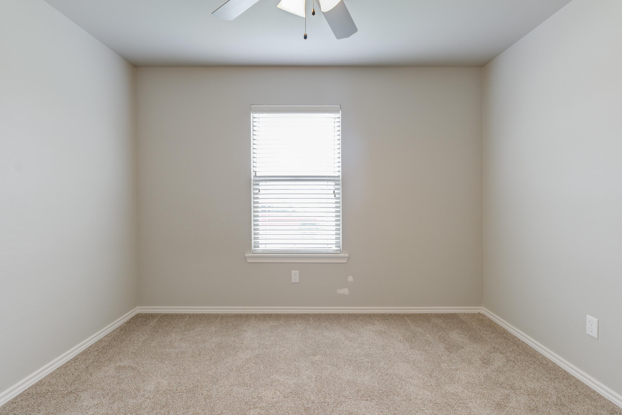 6902 67th Street Lubbock, TX 79424 - Photo 19 of 35 an empty room with a window