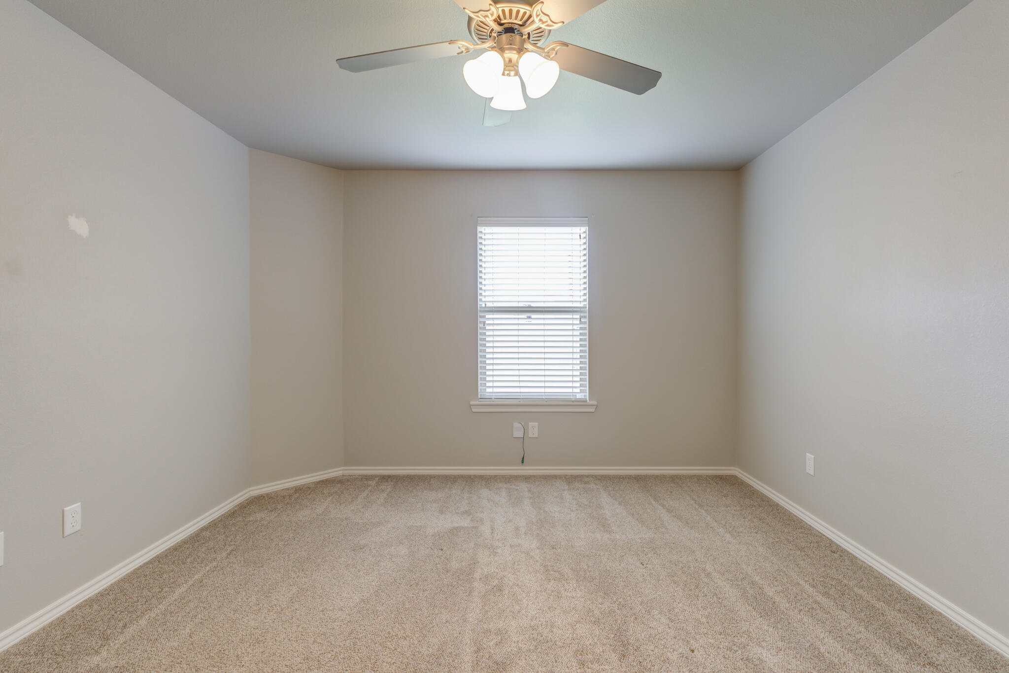 6902 67th Street Lubbock, TX 79424 - Photo 24 of 35 an empty room with a window