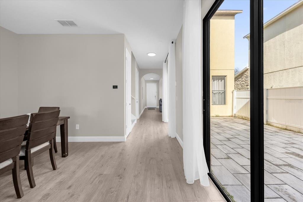 9657 Moss Rose Way Orlando, FL 32832 - Photo 7 of 33 a view of a hallway and wooden floor