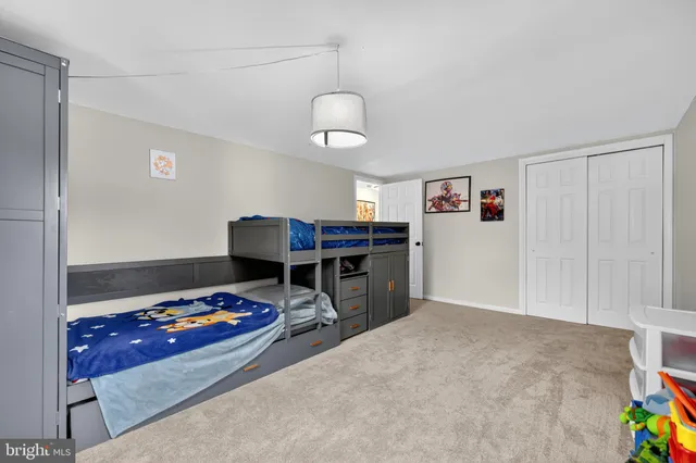 a bedroom with furniture and a chandelier