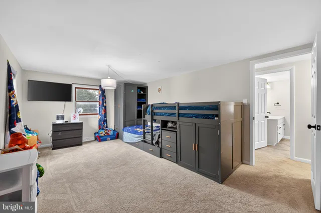 a view of a livingroom with furniture and a flat screen tv