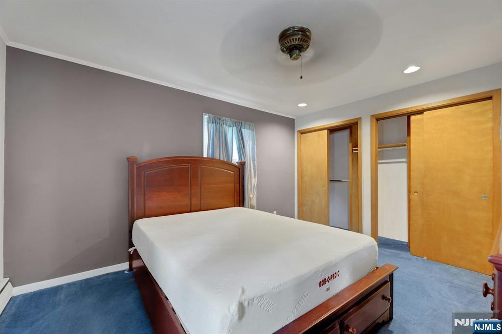 17 Butler Place Wanaque, NJ 07420 - Photo 21 of 28 a bedroom with a bed and a window