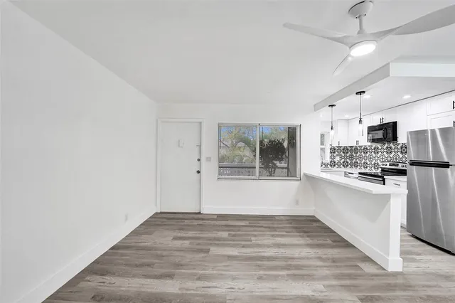 a view of a kitchen with electric appliances