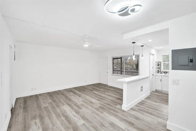 a view of kitchen with microwave and cabinets