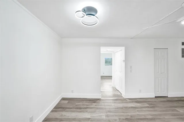 a view of room with wooden floor