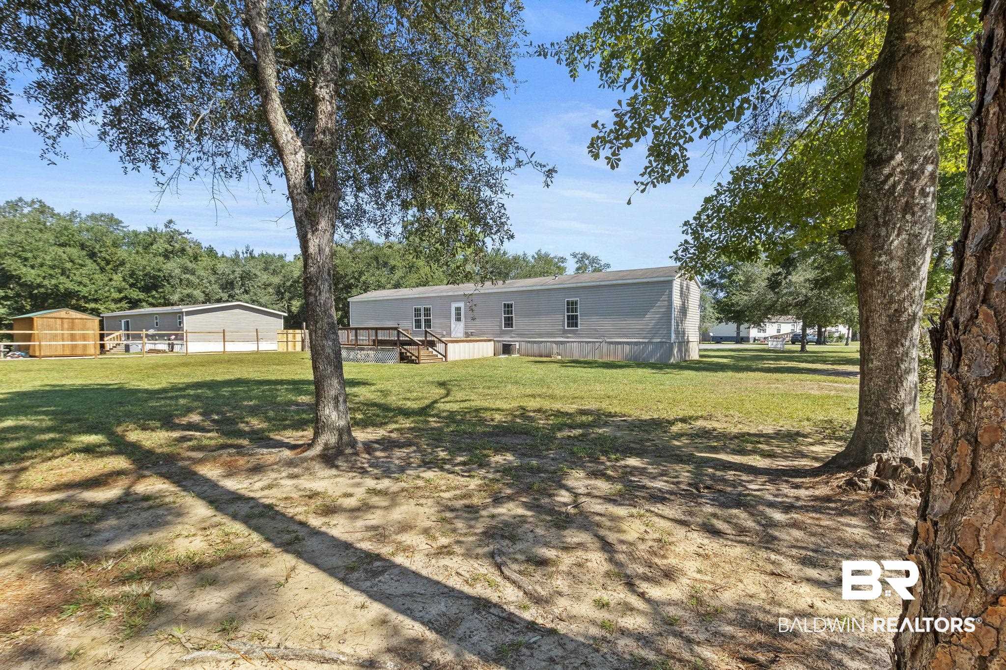 6870 Cecilia Court Theodore, AL 36582 - Photo 51 of 83 View of yard with a deck