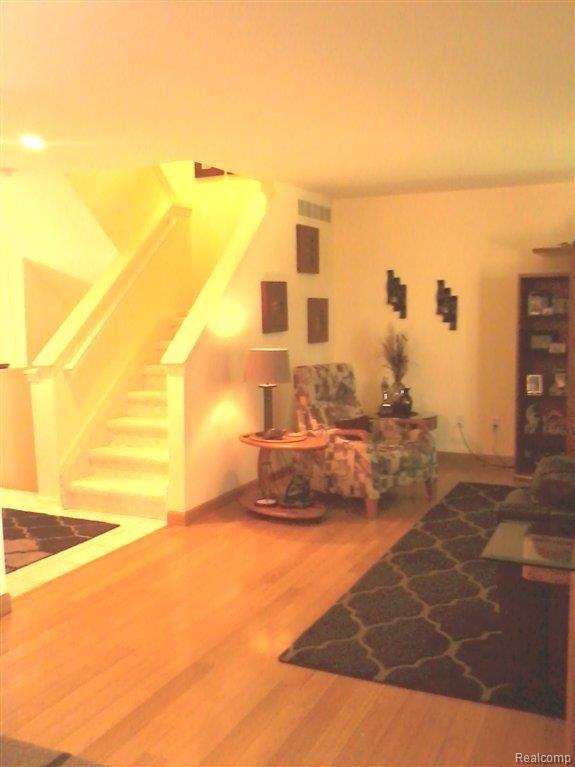 23075 Farmington Road, Unit 15 Farmington, MI 48336 - Photo 5 of 24 Great Room opens to Upper Level.