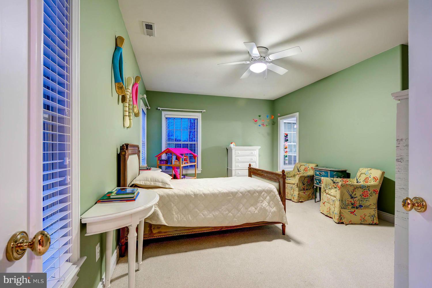 2230 Monkton Road Monkton, MD 21111 - Photo 22 of 30 a bedroom with a bed and a chandelier