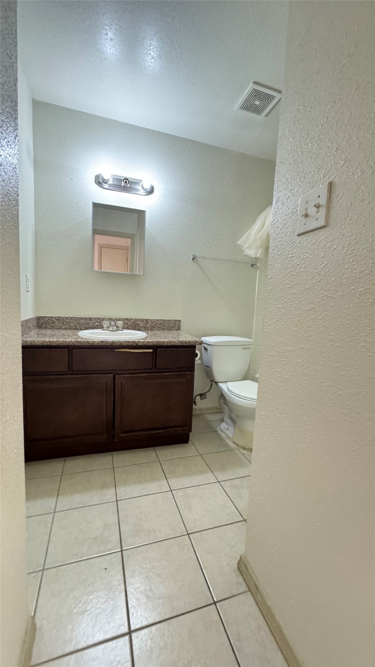 10802 Kingspoint Road Houston, TX 77075 - Photo 13 of 18 a bathroom with a sink a toilet and mirror