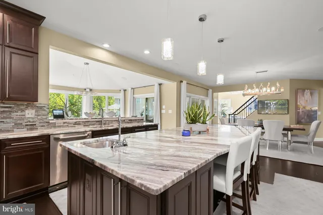 a living room with furniture fireplace and a large mirror