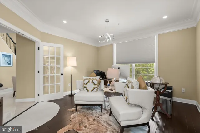 a bathroom with a sink mirror and toilet