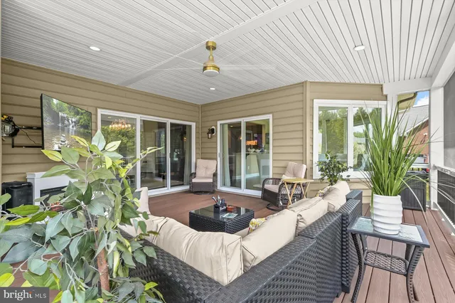 a view of entryway with wooden floor and windows