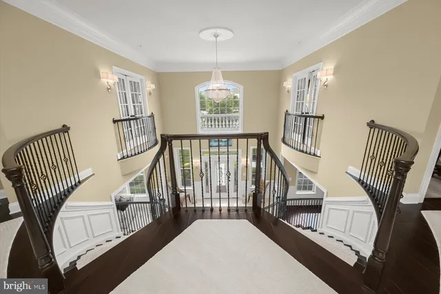 a room with stainless steel appliances kitchen island granite countertop a refrigerator and microwave