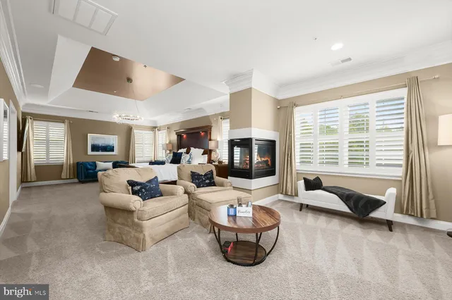 a living room with furniture a window and a table