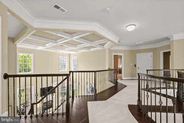 a living room with furniture a fireplace and a large window
