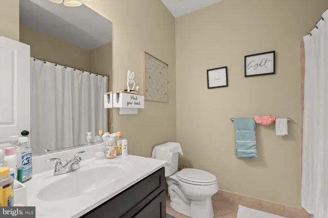 a kitchen with stainless steel appliances kitchen island granite countertop a stove top oven a sink dishwasher a dining table and chairs with wooden floor