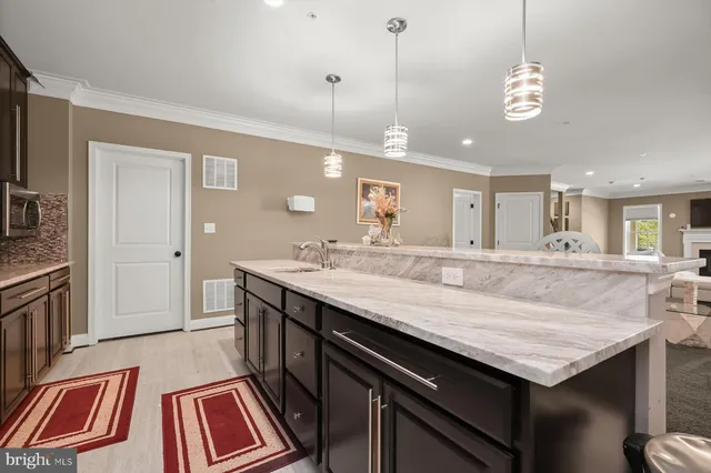 a view of a swimming pool with an outdoor seating and a yard