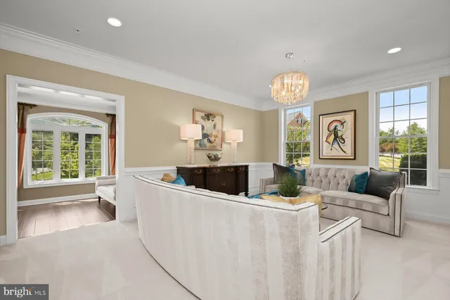 a kitchen with a table chairs sink and cabinets