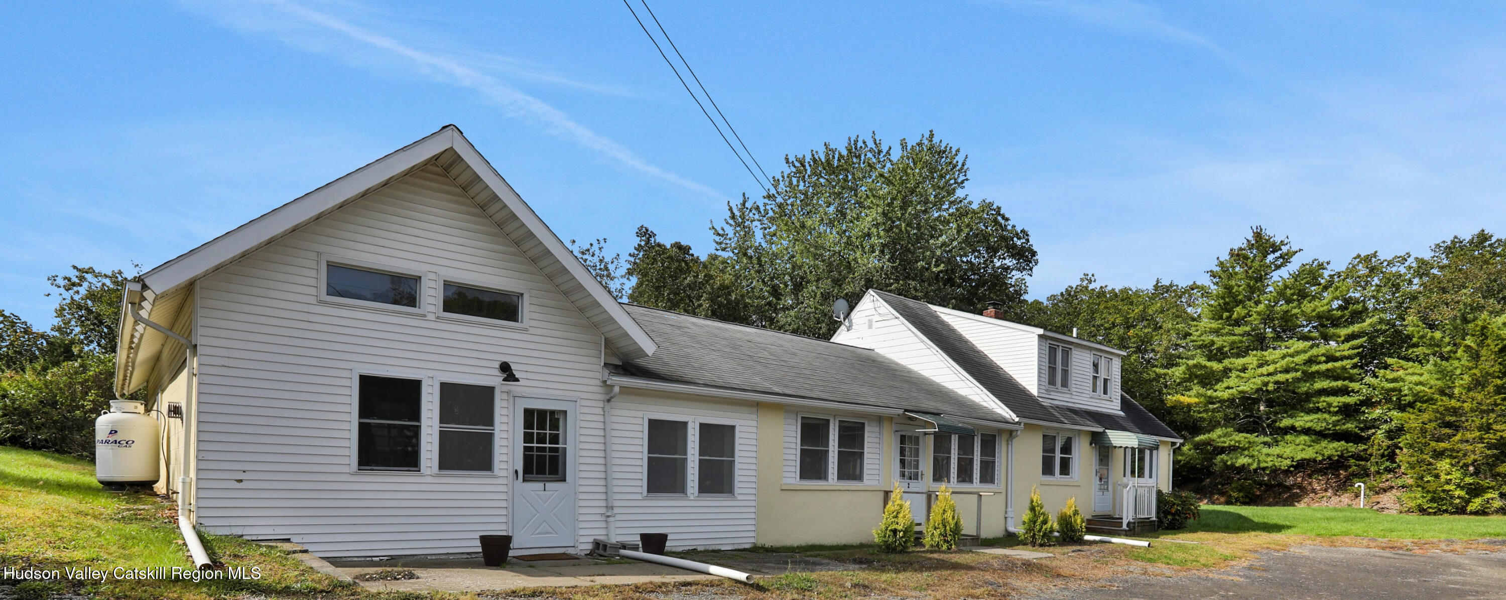 a view of a house with a yard