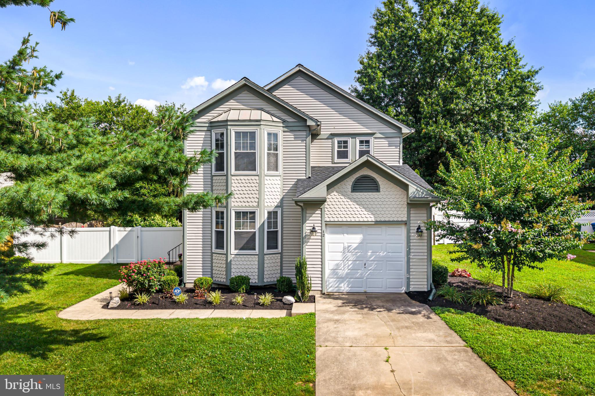 12 Apple Way Marlton, NJ 08053 - Photo 1 of 47 a front view of a house with a yard and garage
