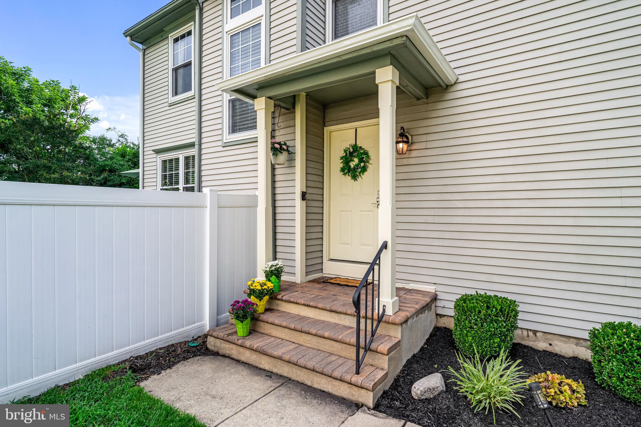 12 Apple Way Marlton, NJ 08053 - Photo 4 of 47 a view of a house with chairs and flower plants