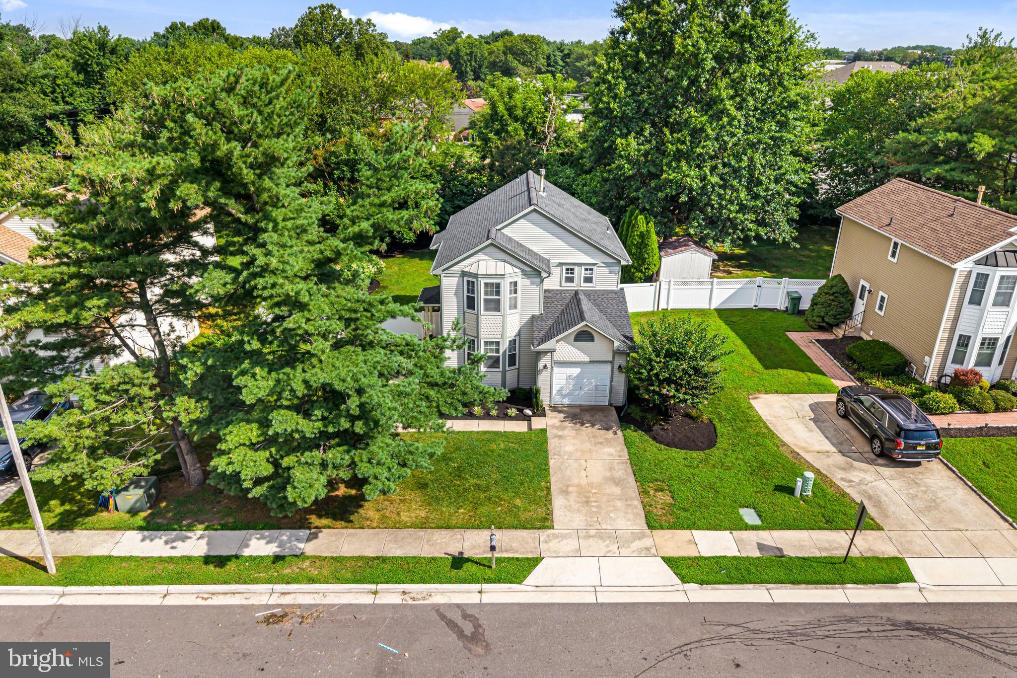 12 Apple Way Marlton, NJ 08053 - Photo 47 of 47 a front view of a house with a yard and potted plants