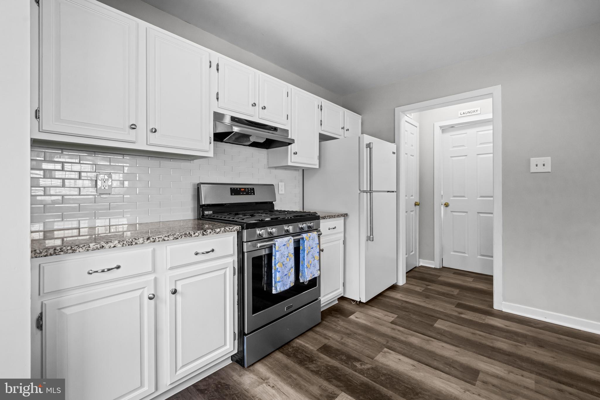 12 Apple Way Marlton, NJ 08053 - Photo 10 of 47 a kitchen with stainless steel appliances white cabinets and a stove top oven