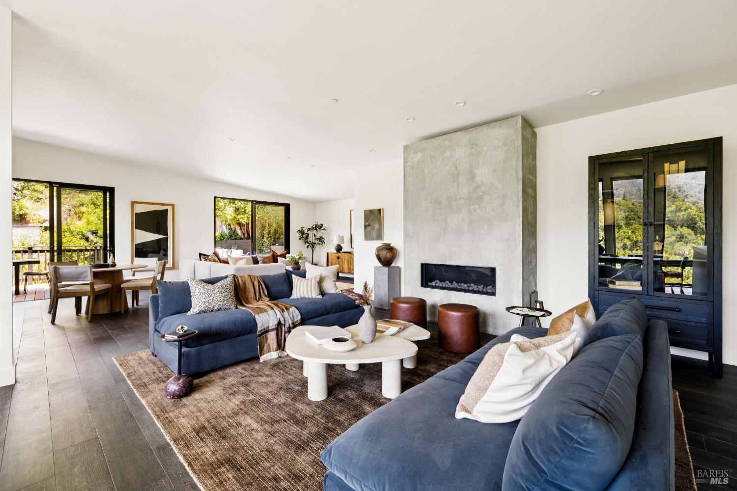 56 Millard Road Larkspur, CA 94939 - Photo 6 of 74 a living room with furniture fireplace and a table
