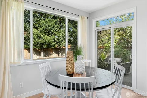 a view of a dining room with furniture window and outside view
