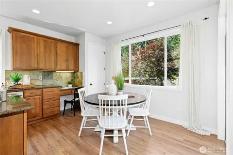 a dining room with furniture window wooden floor