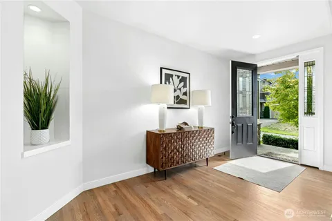 a living room with furniture and a garden