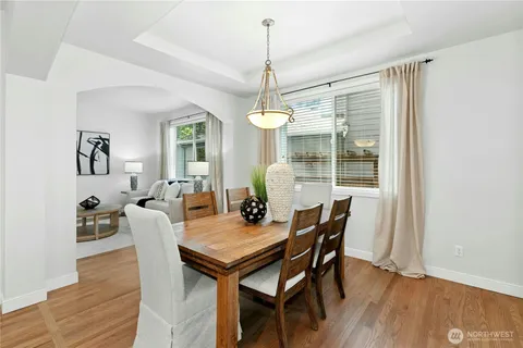 a dining room with furniture window wooden floor