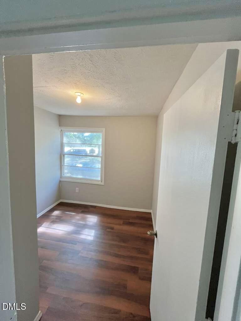 185 Summerhill Road Turkey, NC 28393 - Photo 17 of 18 a view of an empty room with wooden floor and a window