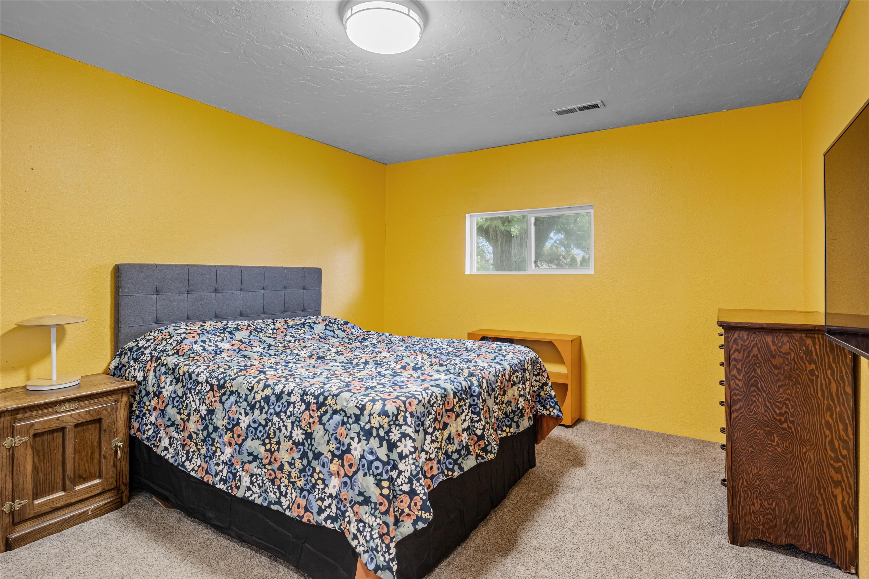6355 Harold Road Central Point, OR 97502 - Photo 11 of 27 a bedroom with a bed and dresser
