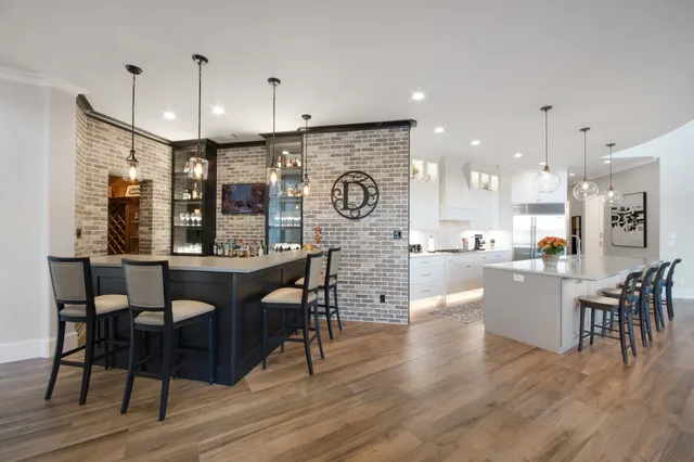 a large kitchen with a table and chairs