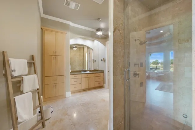 a bathroom with a tub sink and mirror