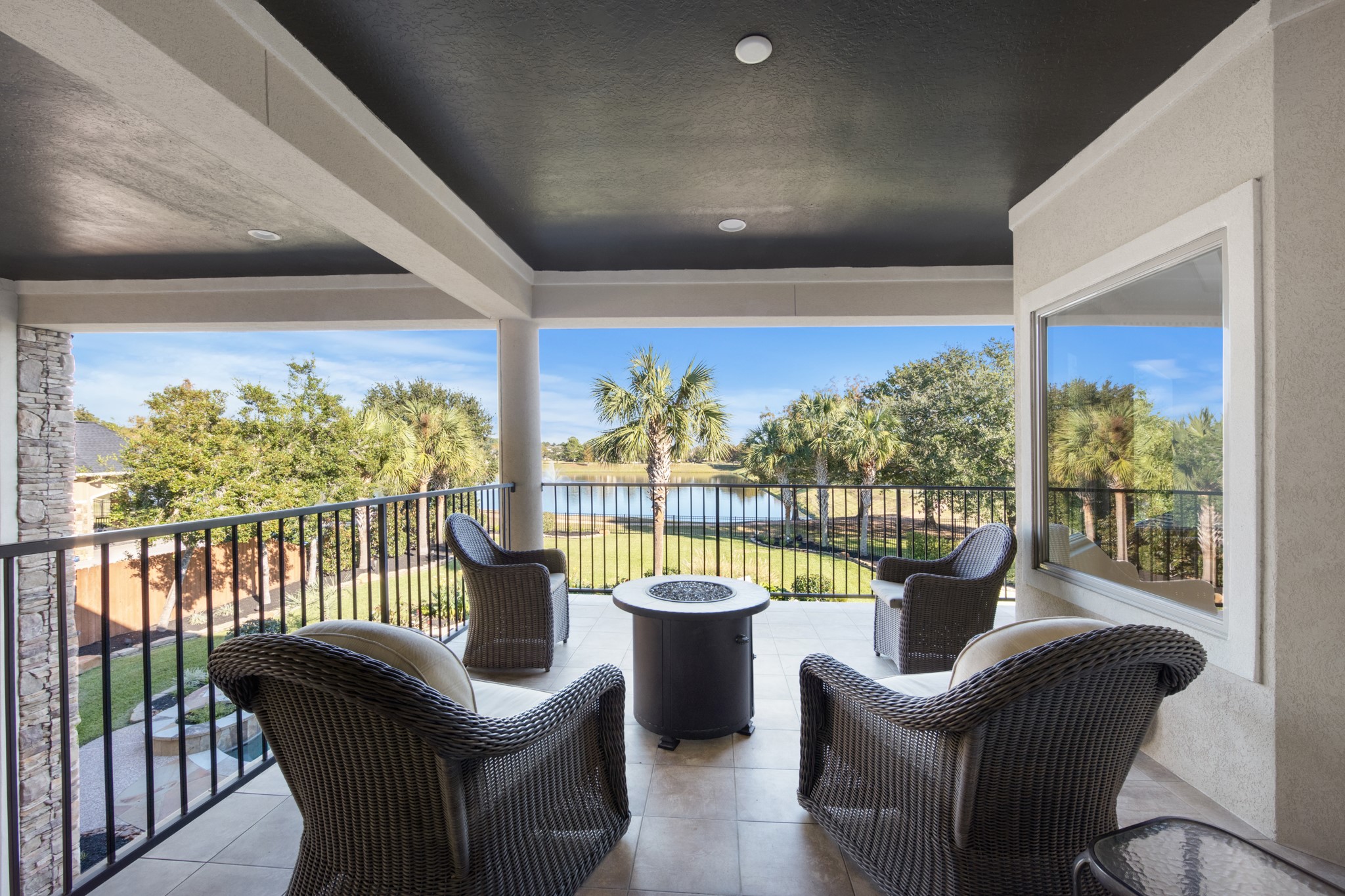 15702 Knauff Ranch Court Cypress, TX 77429 - Photo 35 of 50 a view of a city from a balcony with furniture