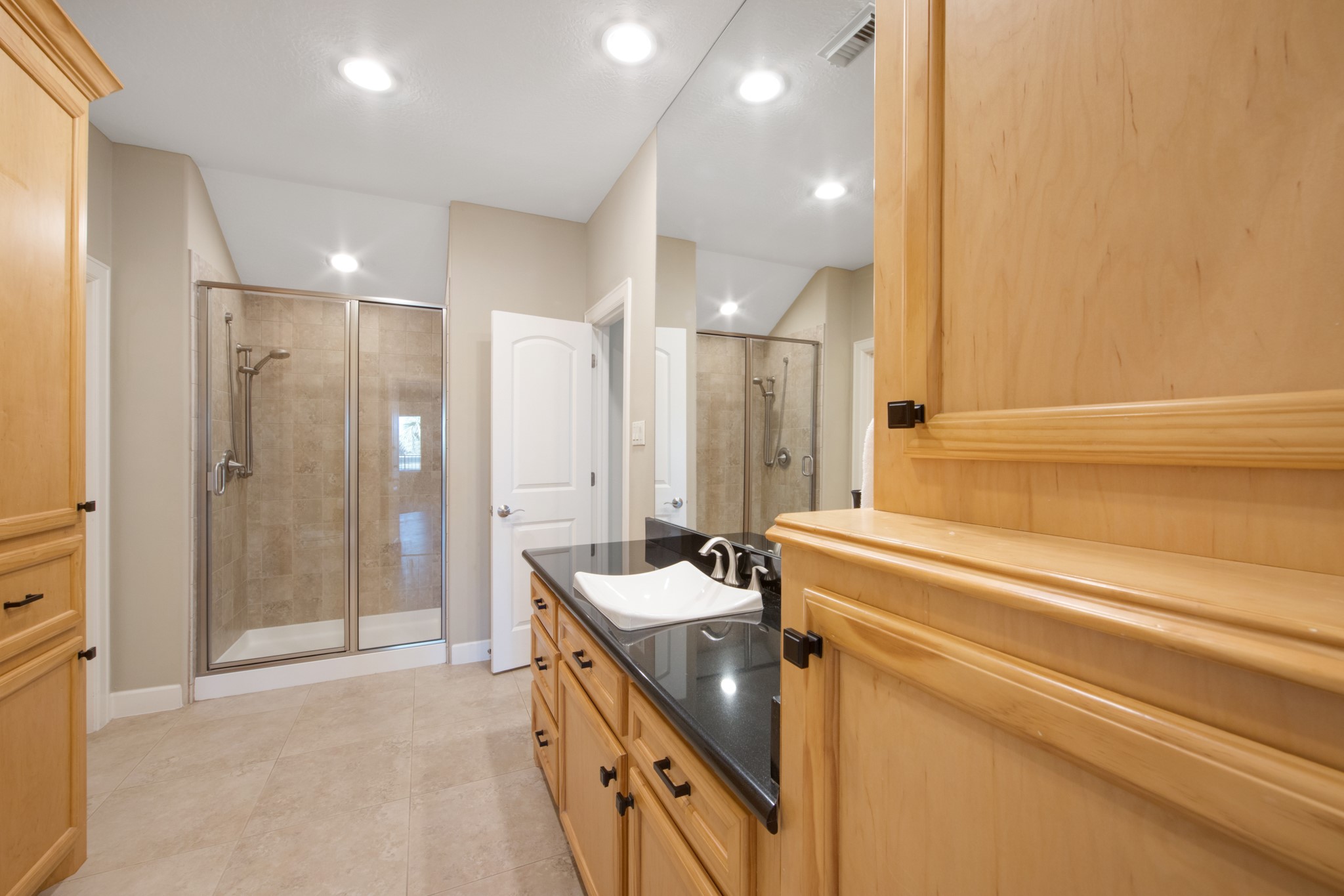 15702 Knauff Ranch Court Cypress, TX 77429 - Photo 37 of 50 a bathroom with a tub sink shower and mirror