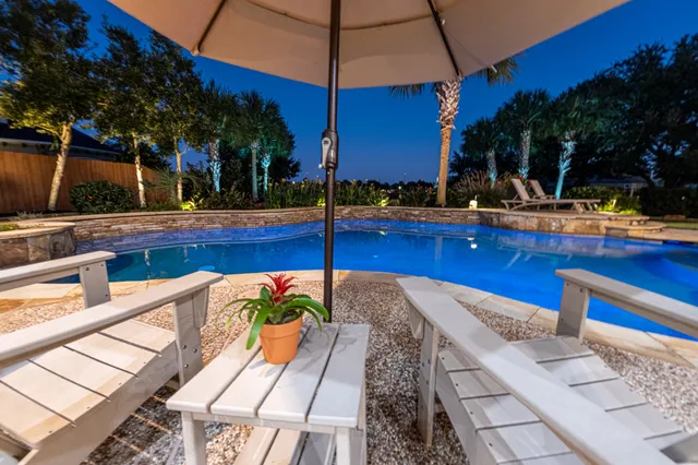 a view of a house with swimming pool