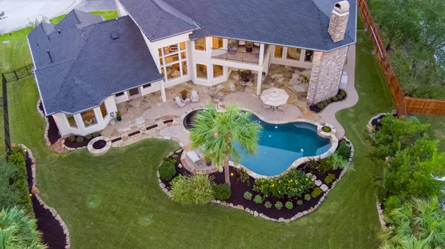 an aerial view of a house having yard