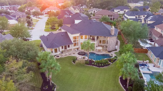 an aerial view of house with yard
