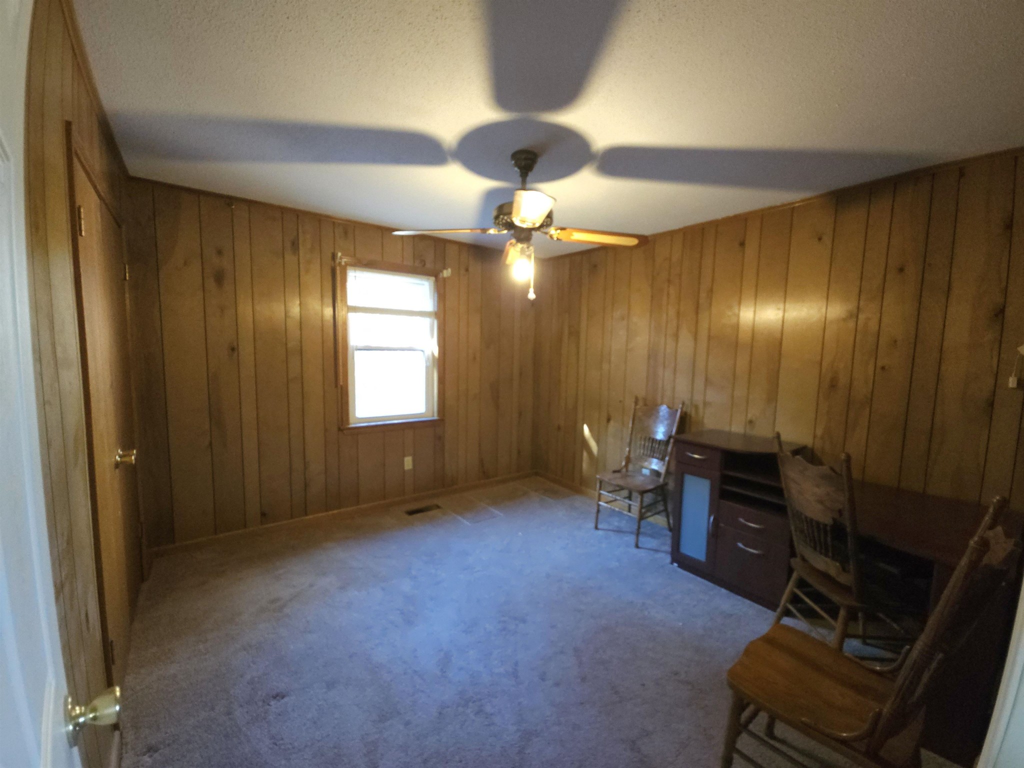 1728 Oil Mill Road Covington, TN 38019 - Photo 11 of 25 an empty room with furniture and chandelier fan