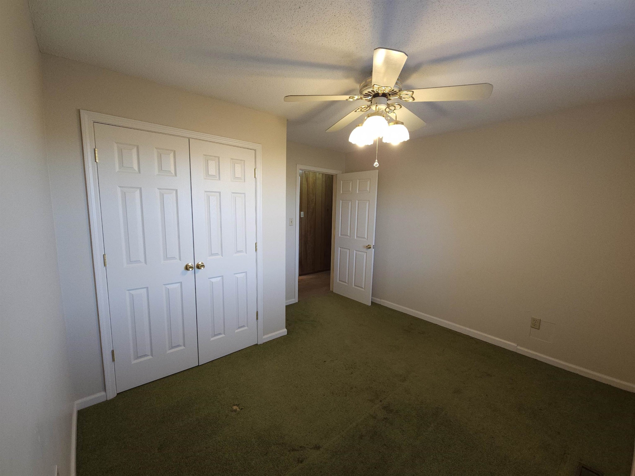 1728 Oil Mill Road Covington, TN 38019 - Photo 15 of 25 an empty room with a fan and a fan