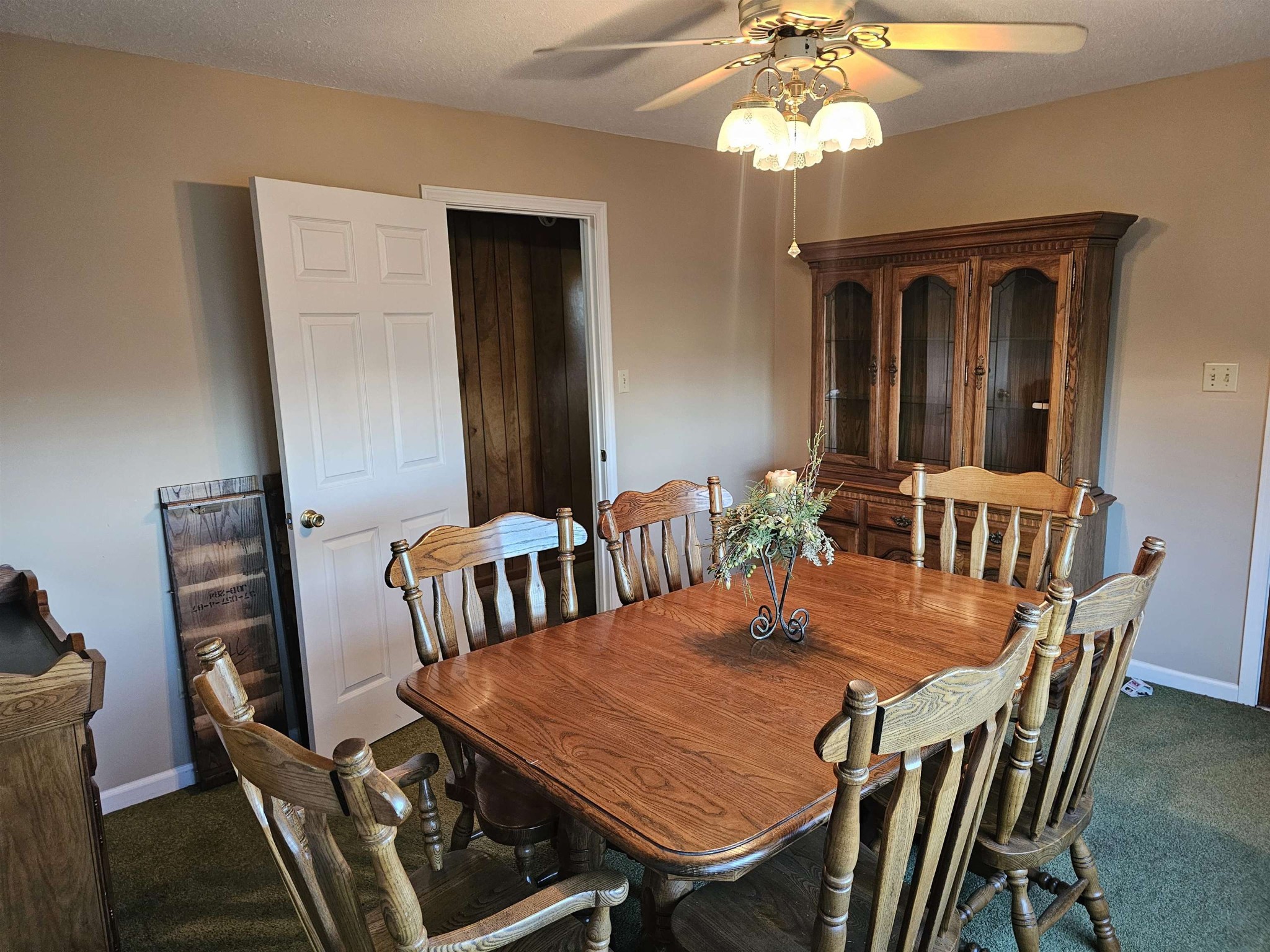 1728 Oil Mill Road Covington, TN 38019 - Photo 6 of 25 a view of a dining room with furniture and a chandelier