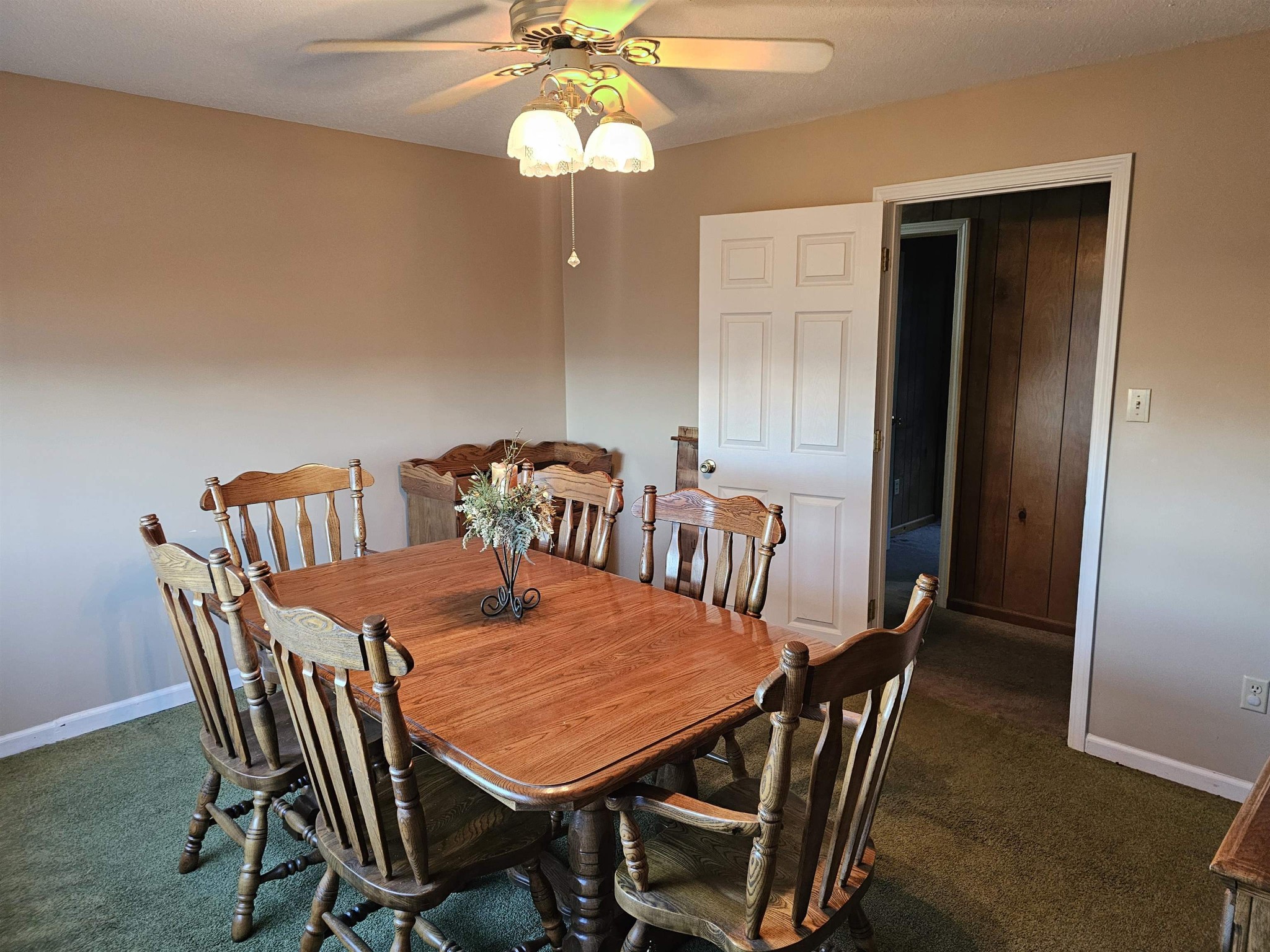 1728 Oil Mill Road Covington, TN 38019 - Photo 7 of 25 a view of a dining room with furniture and wooden floor