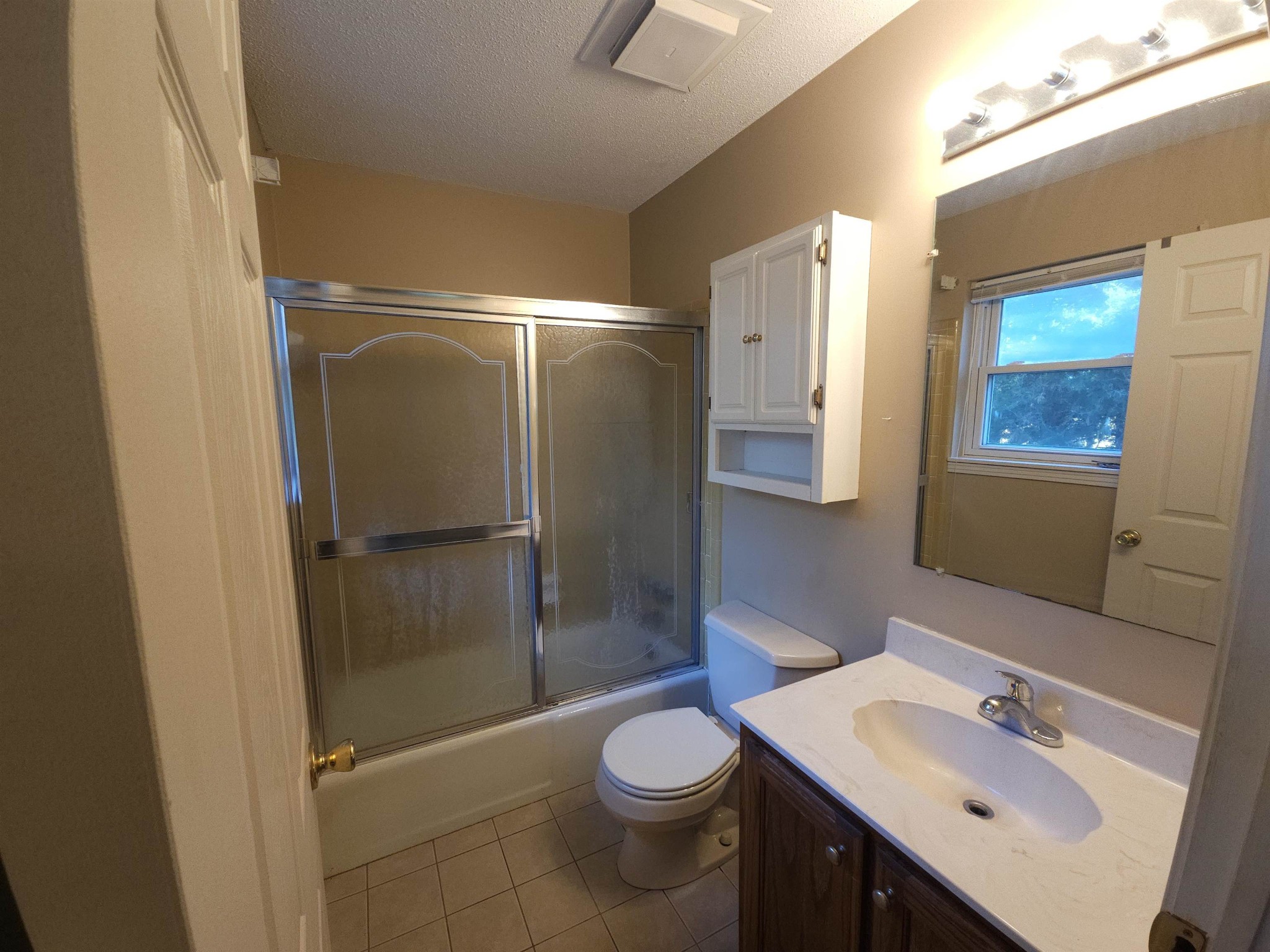1728 Oil Mill Road Covington, TN 38019 - Photo 10 of 25 a bathroom with a sink toilet and shower