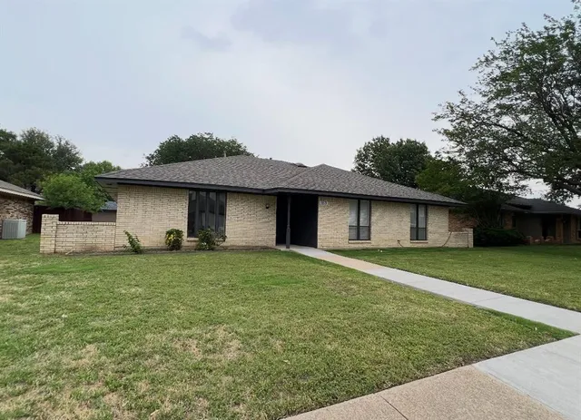 a house view with a garden space