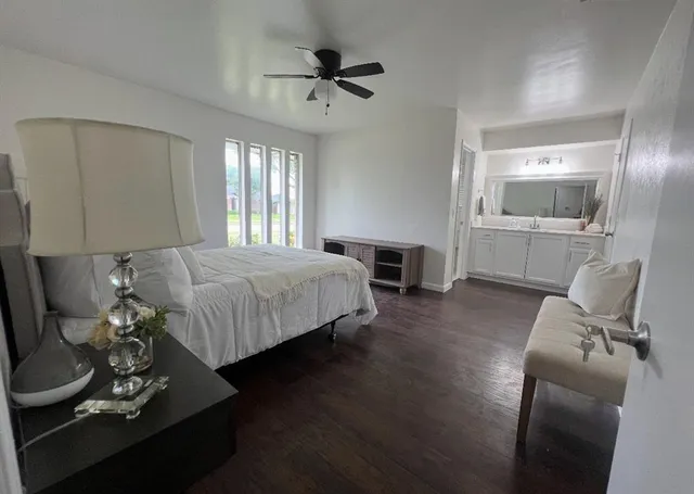 a bed room with a bed window and a couch