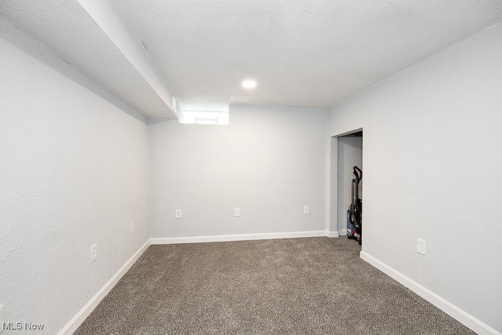 5607 Ridgewood Avenue Parma, OH 44129 - Photo 19 of 23 Spare room with carpet floors and a textured ceiling